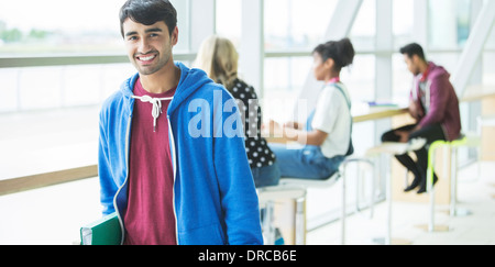 University Student smiling in cafe Banque D'Images