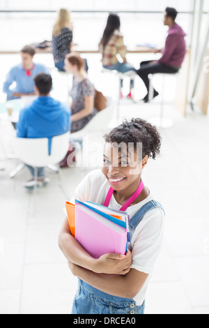 University Student smiling in lounge Banque D'Images