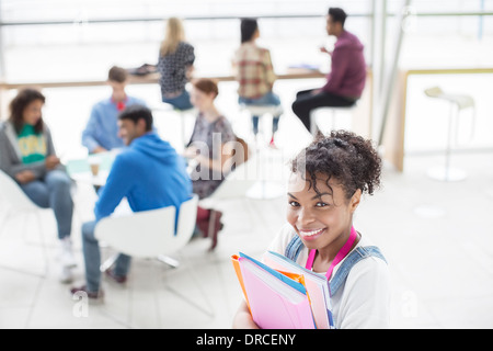 University Student smiling in lounge Banque D'Images