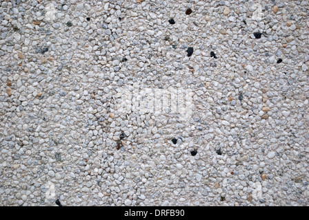 La texture du mur de petites pierres et de poudre de pierre, macro pour le fond et le papier peint. Banque D'Images