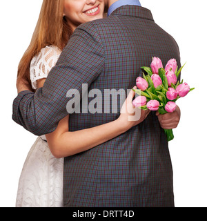 Jeune couple dans l'amour tenant un bouquet de tulipes. Le concept de la Saint-Valentin Banque D'Images