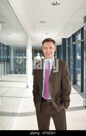 Portrait of businessman in corridor Banque D'Images