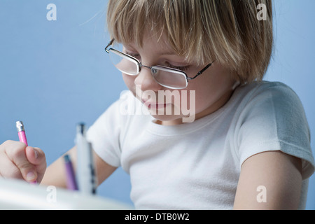 Boy doing homework, close-up Banque D'Images