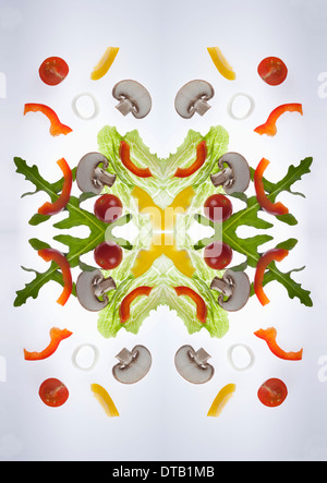 A digital composite of mirrored images de pièces d'une salade de légumes mélangés Banque D'Images