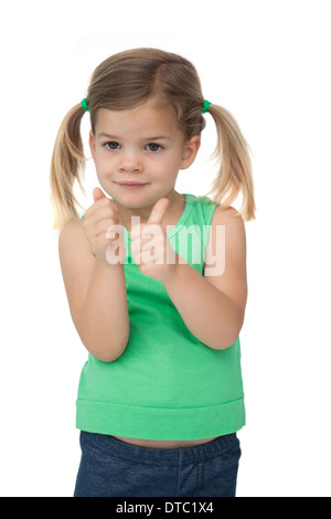 Cute little girl smiling at camera giving Thumbs up Banque D'Images