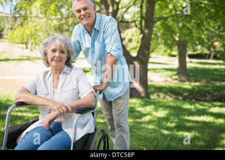 Smiling mature man with woman at park Banque D'Images