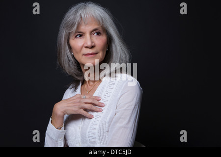 Studio portrait of senior woman