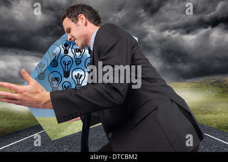 Composite image of businessman posing with arms out Banque D'Images