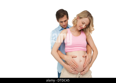 Les futures mères heureux parents holding baby bump Banque D'Images