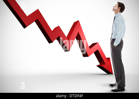 Composite image of businessman standing with hands in pockets Banque D'Images