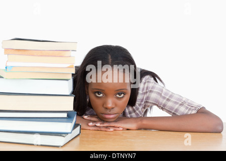 Bored student leaning on her hands Banque D'Images