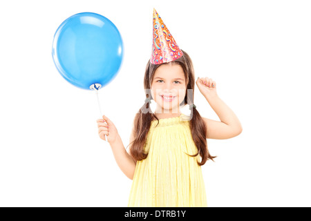 Cute little Girl with party hat holding balloon Banque D'Images