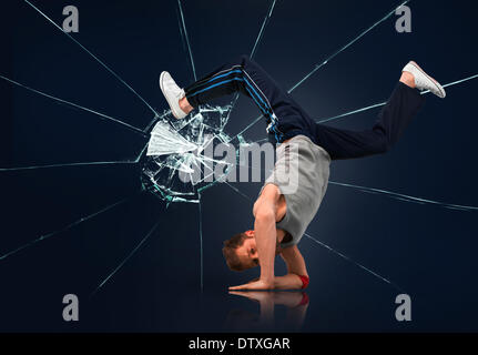 Break dancer balancing on forearms Banque D'Images