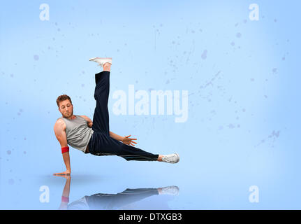 Break dancer balancing on one hand Banque D'Images