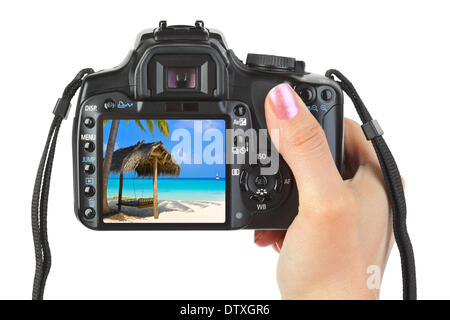 Appareil photo en main et paysage plage Banque D'Images