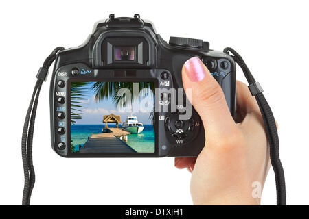 Appareil photo en main et paysage plage Banque D'Images