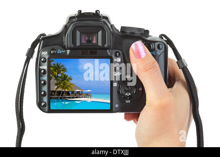 Appareil photo en main et paysage plage Banque D'Images