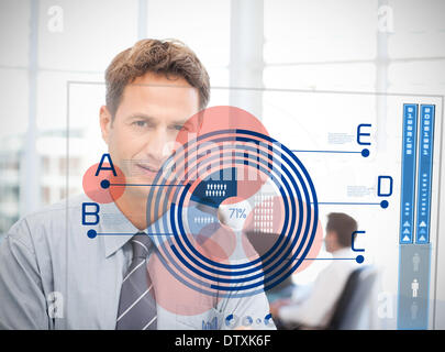 Businessman looking at blue diagram interface Banque D'Images