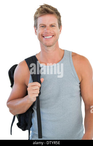 Smiling man in sportswear holding backpack Banque D'Images