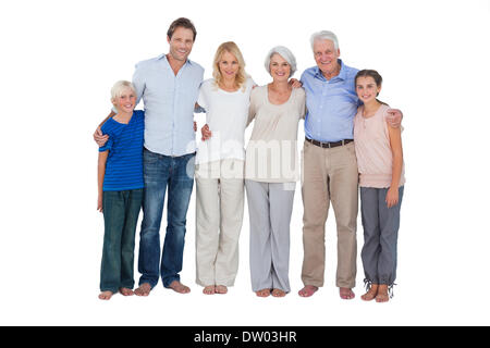 Family standing against a white background Banque D'Images