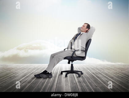 Businessman sitting on a chair Banque D'Images