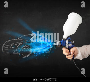 Aérographe peinture travailleur avec des lignes à la main Banque D'Images