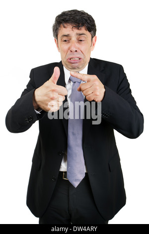 L'homme d'affaires en larmes pointant vers son pouce blessé avec une expression pitoyable affligeant isolated on white Banque D'Images