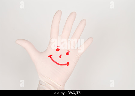Sourire dessiné sur une main. Banque D'Images