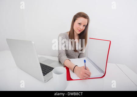 Portrait of beautiful businesswoman documents in office 24 Banque D'Images