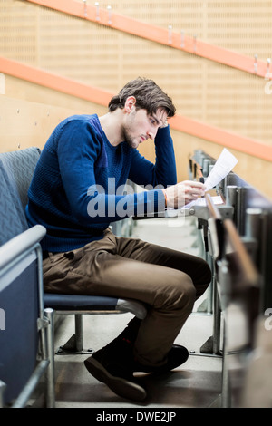 Male student studying in classroom Banque D'Images