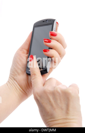 Téléphone mobile dans la main de femme rouge avec clous Banque D'Images