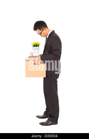 Portrait of a businessman carrying a tiré fort en studio Banque D'Images