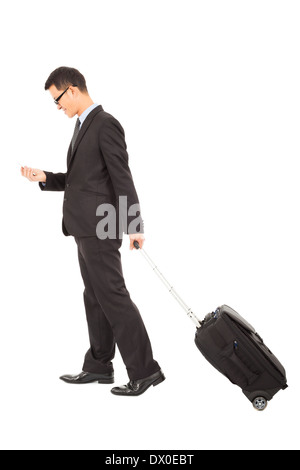 Businessman walking et à l'aide de phone with briefcase isolated on white Banque D'Images