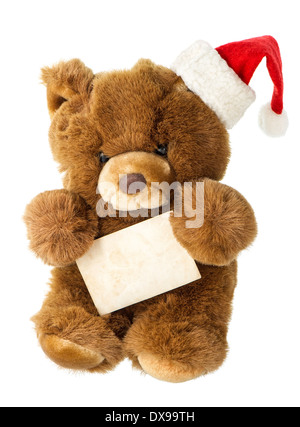 Cute vintage teddy bear with santa hat and greetings card. Décoration de Noël Banque D'Images