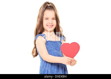 Little girl holding a red heart Banque D'Images