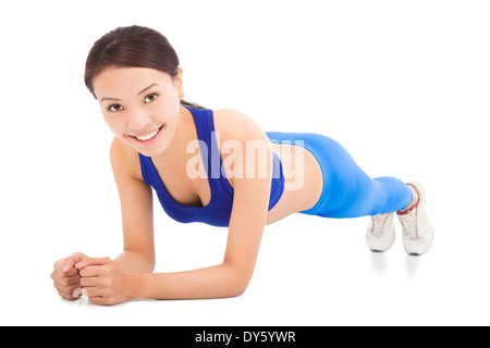 Jeune femme sportive faisant exercice de base Banque D'Images