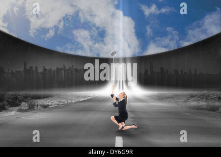 Image composite de businesswoman pulling down blue sky Banque D'Images