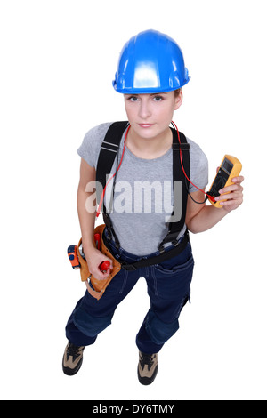 Female electrician prendre lecture Banque D'Images