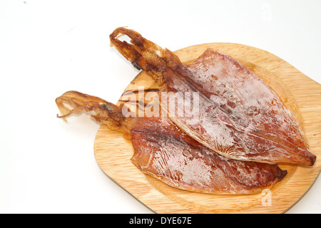 Calmar séché sur plaque de bois Banque D'Images