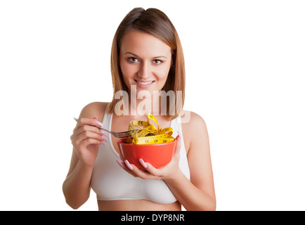 Notion de droit d'une femme sur un régime alimentaire, manger un ruban à mesurer, isolated on white Banque D'Images