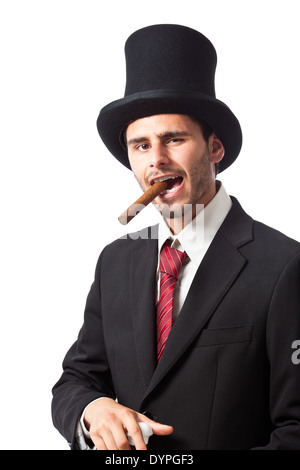 Un riche homme d'affaires avec un cigare, porter un grand chapeau et portant un bâton de marche Banque D'Images