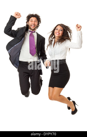 Un bel homme d'affaires et un gorgeous businesswoman jumping over a white background Banque D'Images