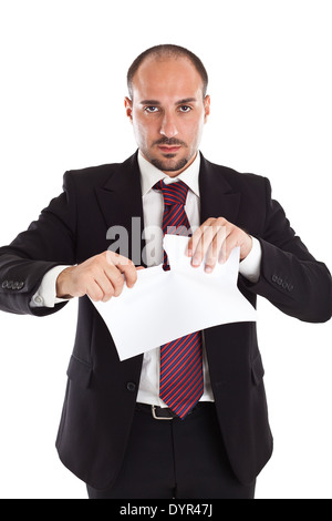 Un businessman déchirant quelques feuilles de papier Banque D'Images