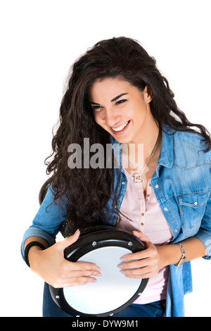 Young woman playing drum Banque D'Images