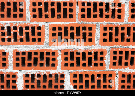 Arrière-plan de mur de briques rouges avec du ciment Banque D'Images