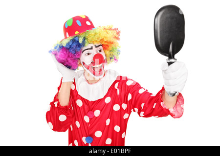 Clown mâle à la recherche d'un miroir Banque D'Images