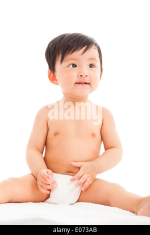 Enfant bébé tout-petit enfant assis sur un livre blanc Banque D'Images