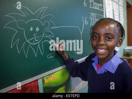 Dessin de fille un lion dans l'école, fondation Africat Okonjima, Namibie Banque D'Images