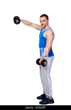 Portrait en pied d'un homme faisant des exercices avec haltères sur fond blanc Banque D'Images