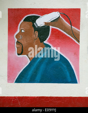 Peinture sur mur publicité salon de coiffure et un coiffeur, Kigali, Rwanda Banque D'Images